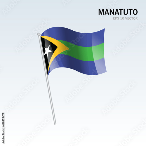 Waving flag of Manatuto districts of Timor Leste on gray background photo