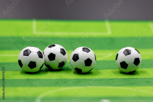 Soccer ball on green grass background © thaninee