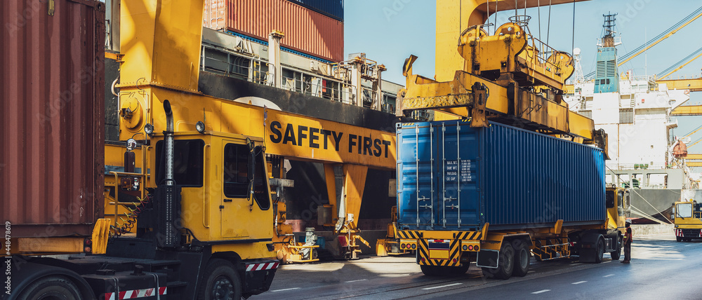 Container Cargo freight ship with working crane loading bridge in shipyard at dusk for Logistic Import Export background Container Cargo freight ship with working crane loading bridge in shipyard at dusk for Logistic Import Export background