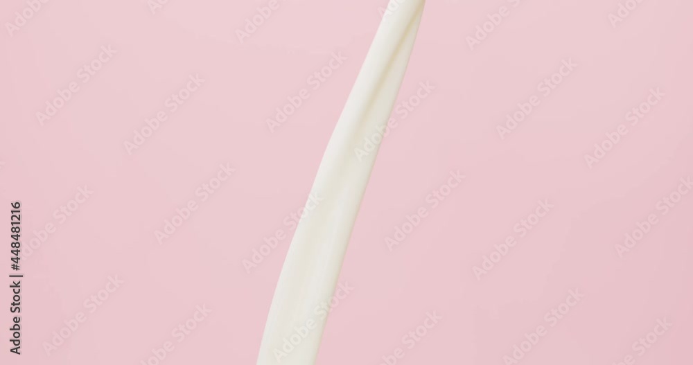 Close up detail - Shot of pouring, splashing fresh milk on pink background, Dairy product concept. Close up detail - Shot of pouring, splashing fresh milk on pink background, Dairy product concept.