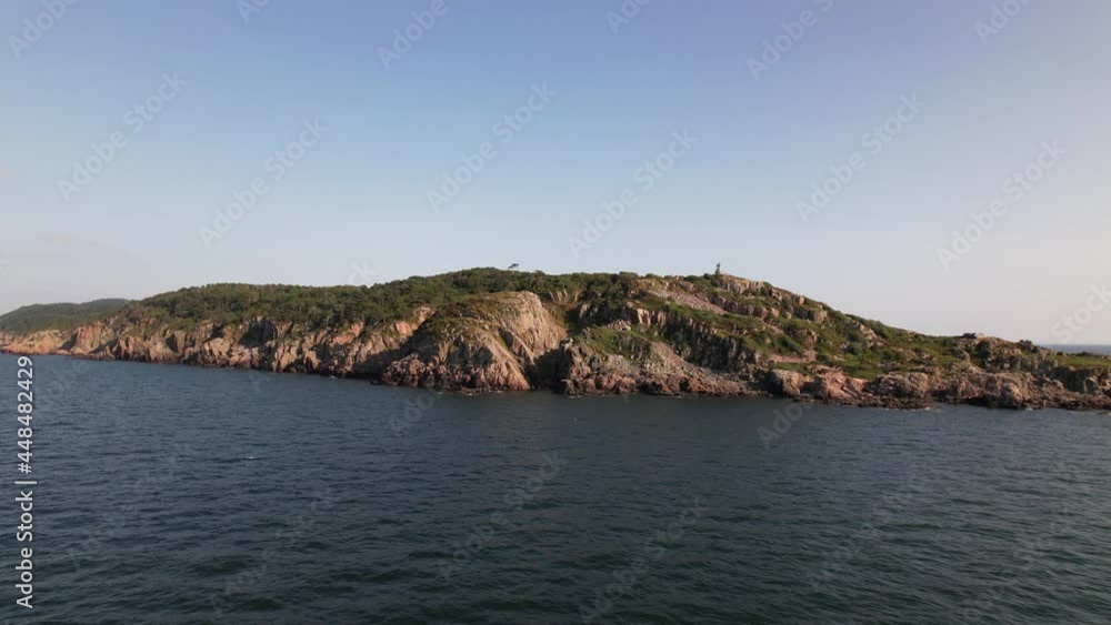 Aerial view, panning left, cliff coast and pier. Kullaberg Sweden Aerial view, panning left, cliff coast and pier. Kullaberg Sweden