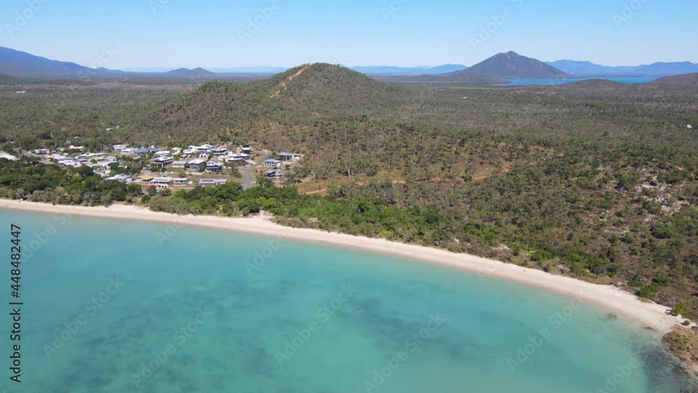 Dingo Beach Foreshore Reserve With Houses In Beachfront Locality In Whitsunday Region, North Queensland, Australia. aerial Dingo Beach Foreshore Reserve With Houses In Beachfront Locality In Whitsunday Region, North Queensland, Australia. aerial