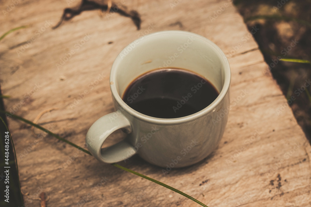 Obraz premium cup of coffee on wooden table