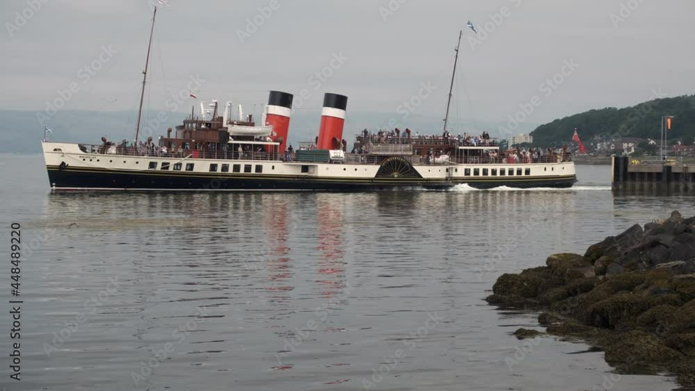 The PS Waverley a paddle steamer sailing in the waters from Largs in Scotland, UK. She was built in 1946 and powered by a triple expansion steam engine. The PS Waverley a paddle steamer sailing in the waters from Largs in Scotland, UK. She was built in 1946 and powered by a triple expansion steam engine.
