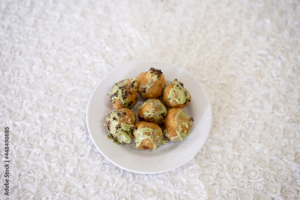 Greek Loukoumades Avocado with Choco Flakes Topping. Avocado Chocolate Lukumades Donuts Doughnut for stop motion footage Greek Loukoumades Avocado with Choco Flakes Topping. Avocado Chocolate Lukumades Donuts Doughnut for stop motion footage