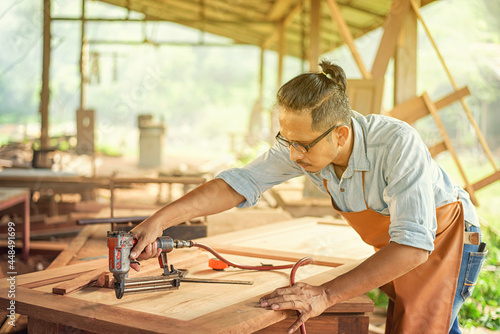 Carpenter Woodwork and furniture making in carpentry workshop