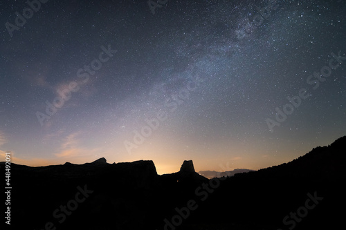 Milky way over the silouhette of mountains