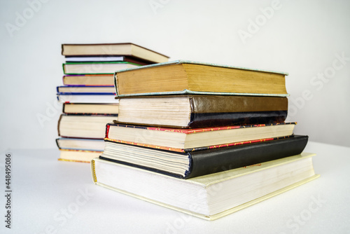 Cuadro en lienzo Stack of old books on white background