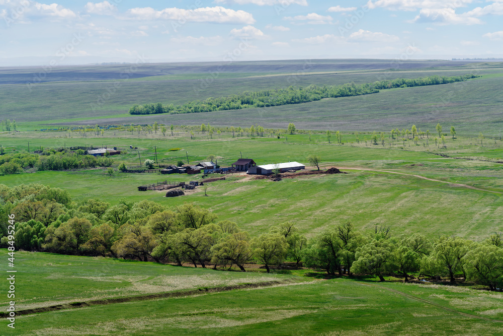 Agricultural farm among the spring fields. Photo taken near the village of Voskresenovka, Orenburg region, Russia