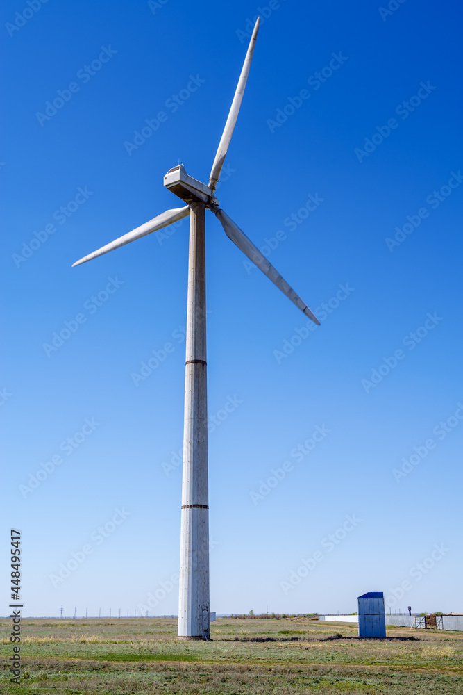 Wind turbine in the spring steppe. The picture was taken in Russia, in the Orenburg region Wind turbine in the spring steppe. The picture was taken in Russia, in the Orenburg region