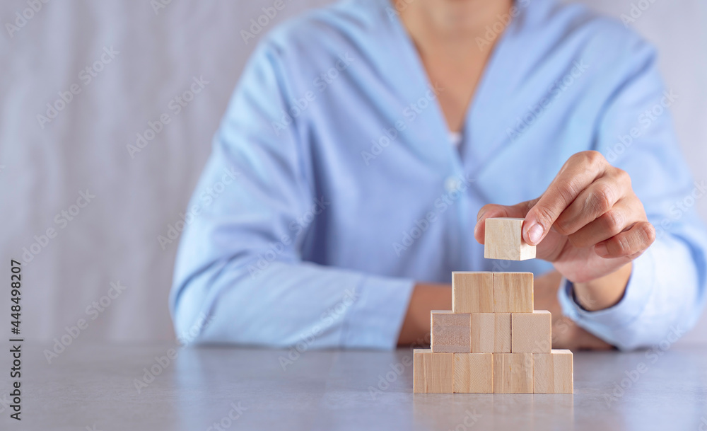 hand stack woods block step on table. business development concept.copy space.