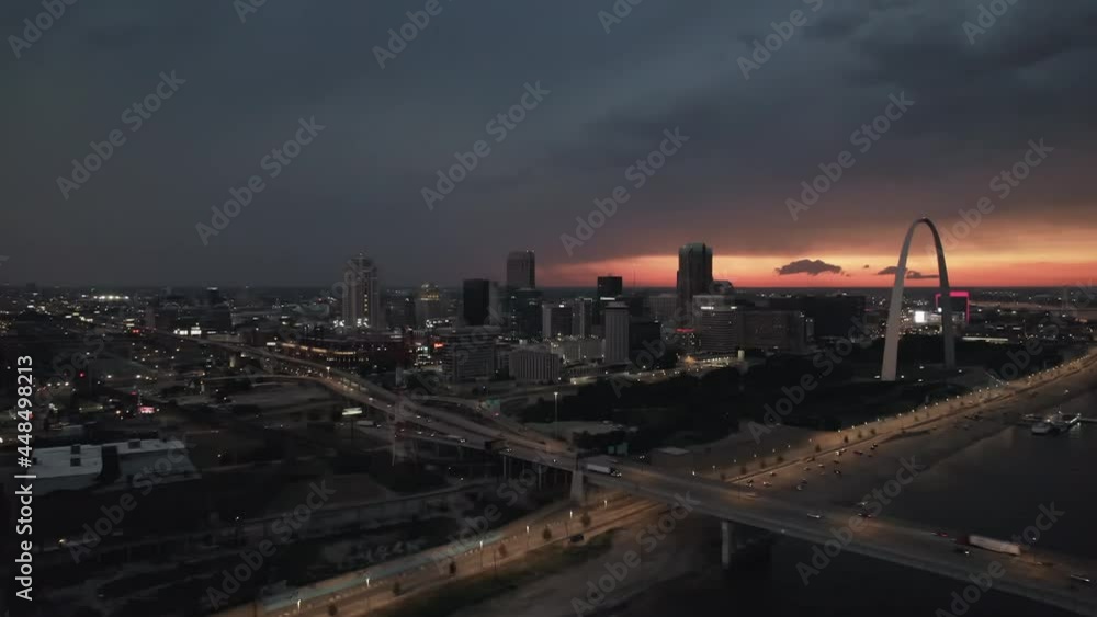 Aerial backwards dolly away from downtown Saint Louis during dark storm Aerial backwards dolly away from downtown Saint Louis during dark storm