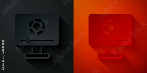 Paper cut Football soccer match on TV icon isolated on black and red background. Football online concept. Paper art style. Vector