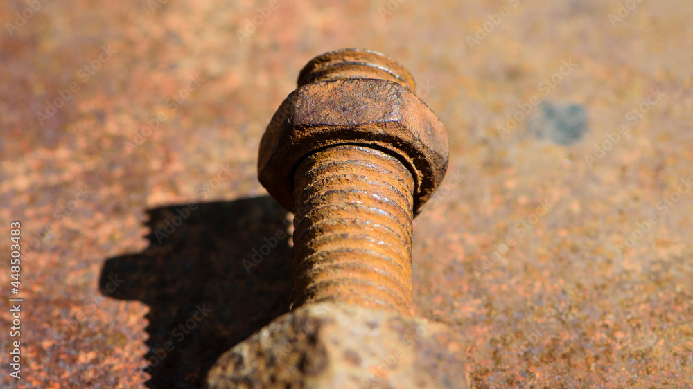 old rusty bolt, iron rod with screw threads. Rusted mechanical