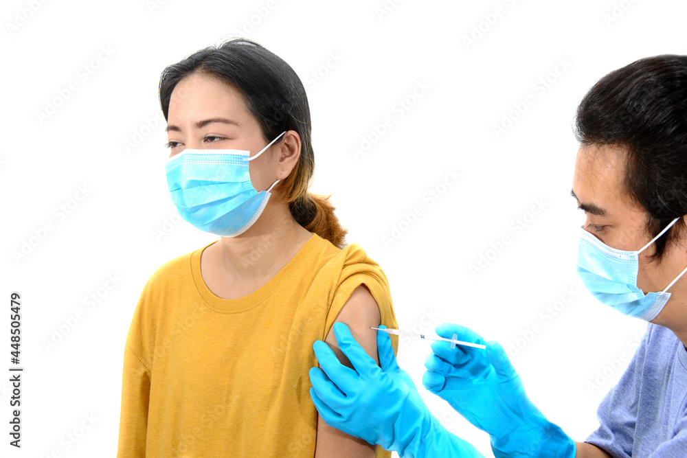 Close up of a Doctor making a vaccination in the shoulder of patient, Close up of a Doctor making a vaccination in the shoulder of patient,