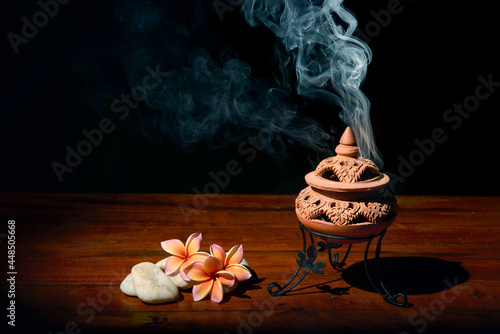 Fotografie, Obraz Incense burner with  flowers on the table
