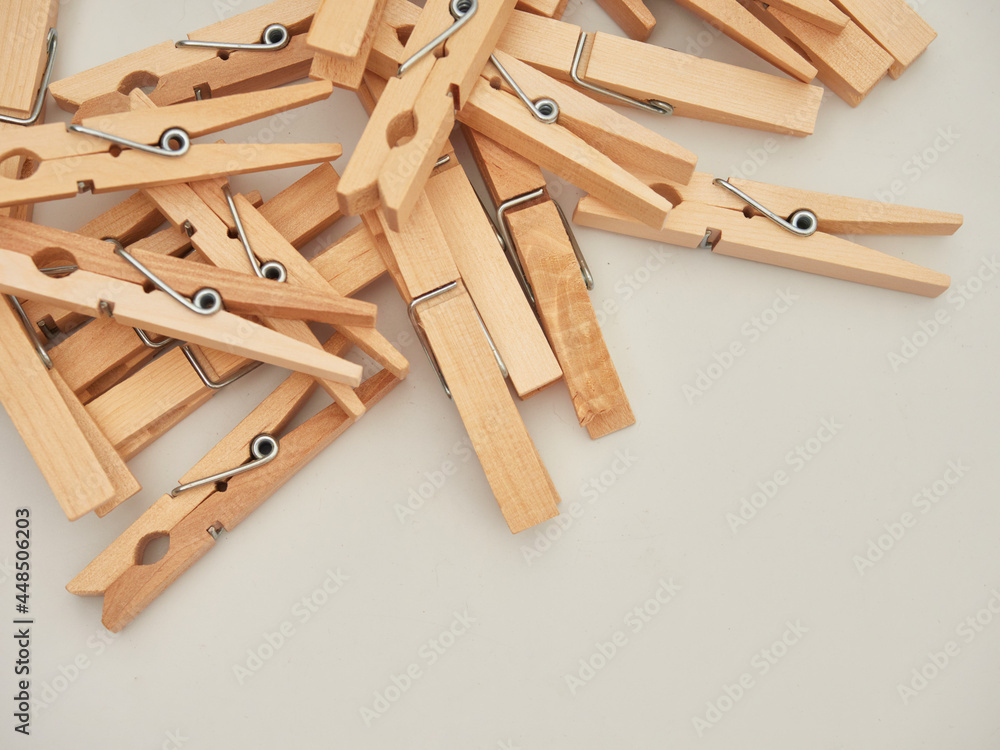 Set of wooden clothes pins on white background Set of wooden clothes pins on white background