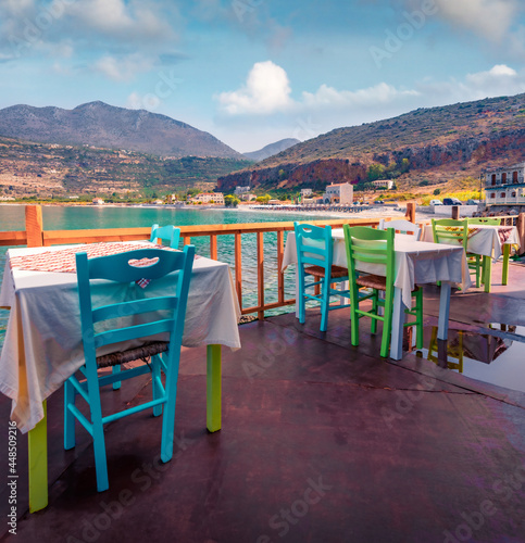 Spectacular summer cityscape of Neo Itilo village. Hospitable cafe on the shore of Ionian sea. Marvelous morning scene of Peloponnese peninsula, Greece, Europe. Traveling concept background.. photo