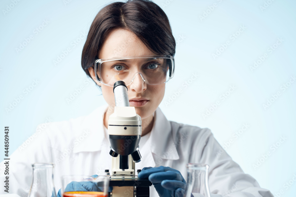 woman scientist with a microscope in the hands of technology research woman scientist with a microscope in the hands of technology research