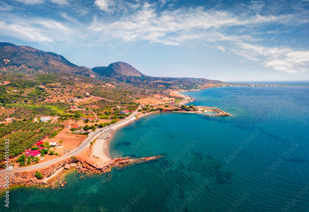 View from flying drone of Pyla beach, Demonia village location. Azure morning seascape of Mediterranean sea. Adorable summer landscape of Peloponnese peninsula, Greece, Europe.