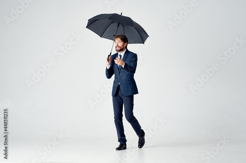 business man in suit umbrella rain protection weather