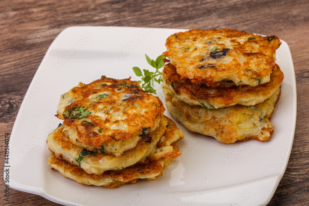 Zucchini pancakes with herbs and spices