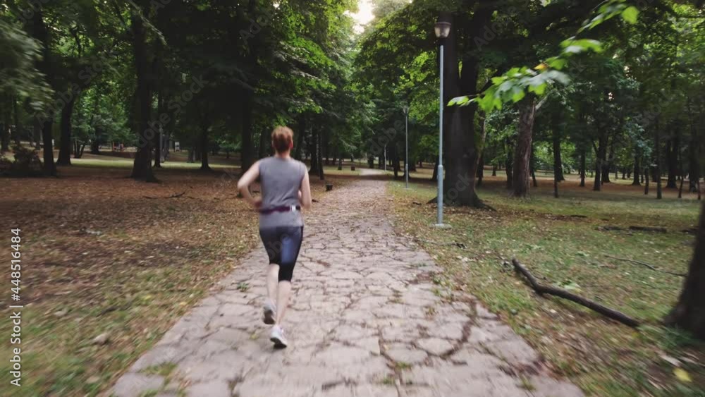 Aerial view of a female while training in the park.
Aerial view of a female while training in the park.