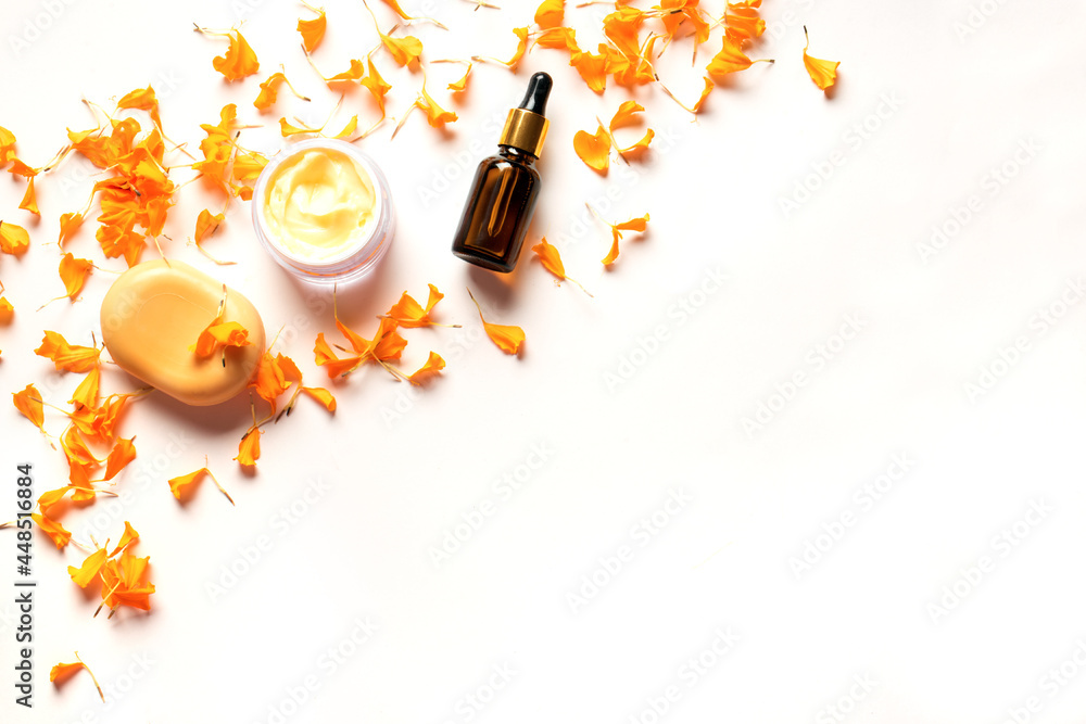 Herbal cosmetics with calendula flower petals - obrazy, fototapety, plakaty 