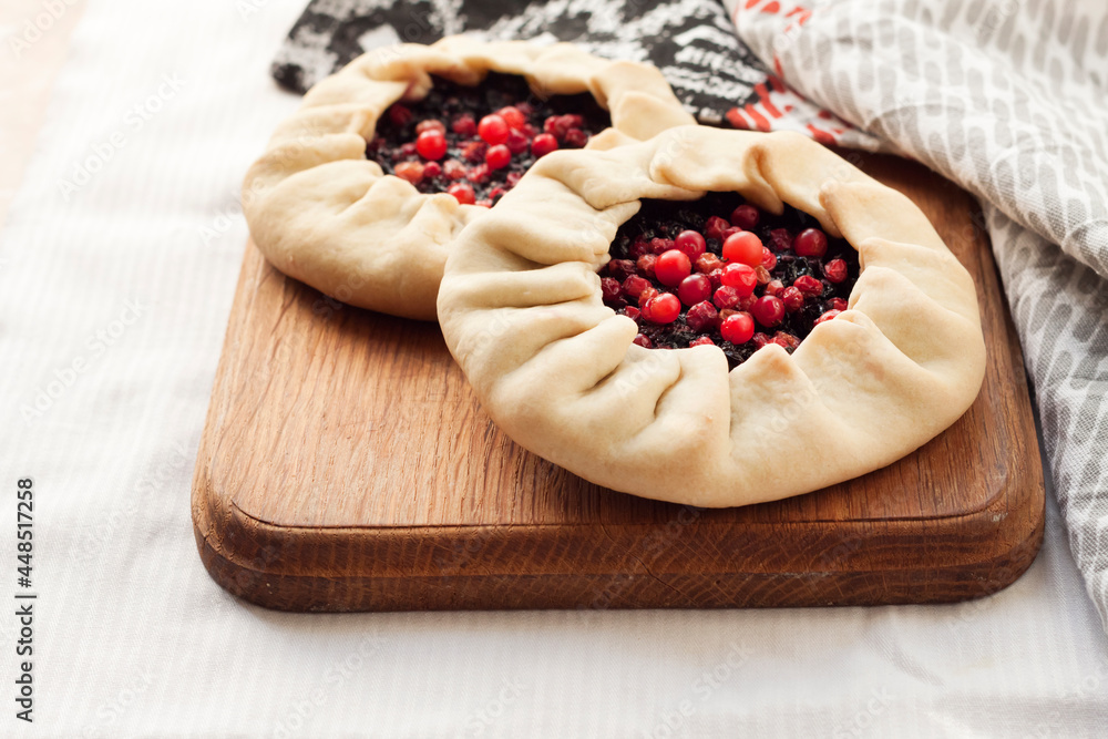 Lenten berry galette on a wooden board Lenten berry galette on a wooden board