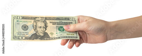 20 dollar in hand isolated on white background, woman hand with banknote, american money banner photo