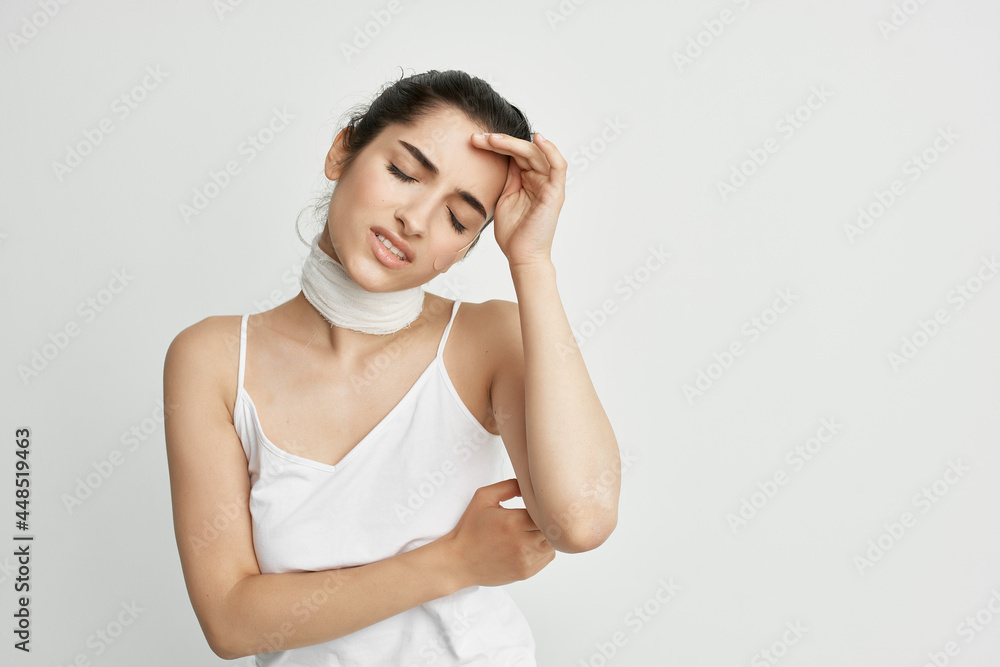 woman with head pain bandage around her neck health problems migraine woman with head pain bandage around her neck health problems migraine