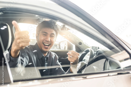 Young Asian man driving car He sometimes smile and thumbs up so happy drive To travel during the outbreak coronavirus covid-19 to male smile image smiling