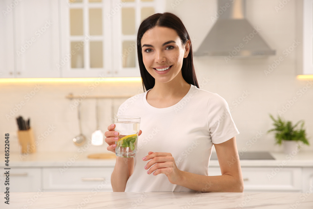 Young woman with glass of fresh lemonade at home Young woman with glass of fresh lemonade at home