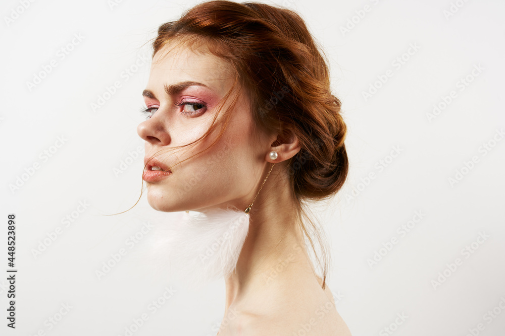 pretty woman with bare shoulders bright makeup fluffy earrings cosmetics Glamor pretty woman with bare shoulders bright makeup fluffy earrings cosmetics Glamor