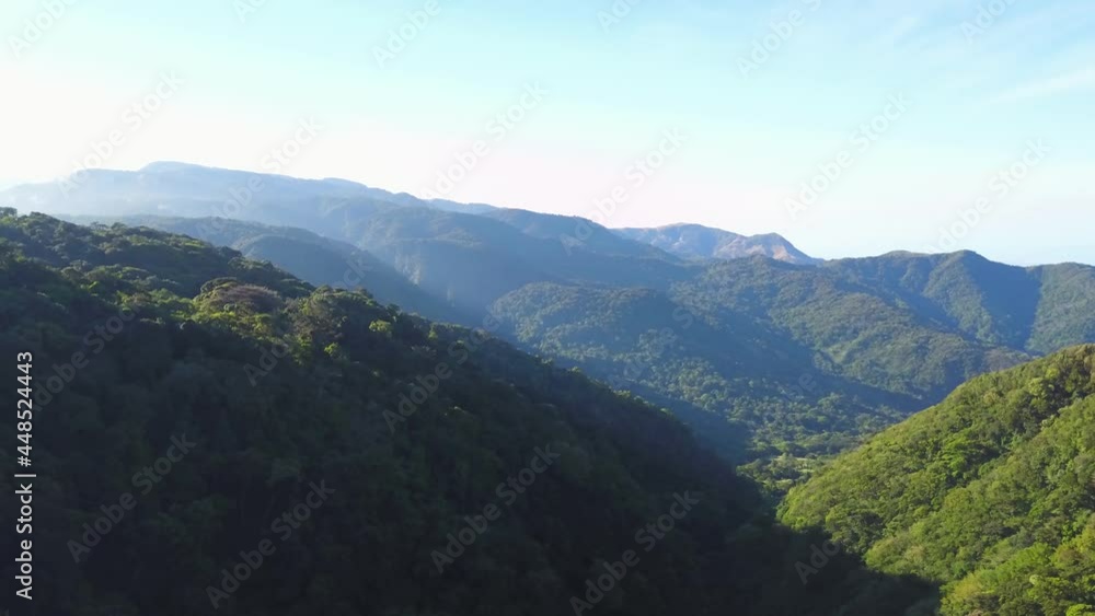Aerial drone view, rising pedestal movement: the valley in the Monteverde Cloud Forest Reserve (Reserva Biológica Bosque Nuboso Monteverde), Costa Rica.
Aerial drone view, rising pedestal movement: the valley in the Monteverde Cloud Forest Reserve (Reserva Biológica Bosque Nuboso Monteverde), Costa Rica.