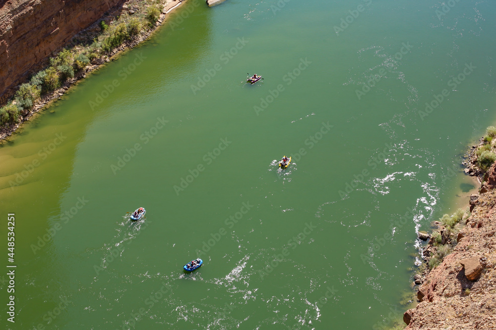View from the Navajo Bridge on tourists rafting on the Colorado River, Arizona, USA View from the Navajo Bridge on tourists rafting on the Colorado River, Arizona, USA