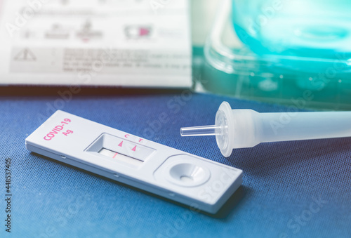 Covid 19 antigen self test for nasal swab with positive result. Antigen test kit for home use to detection coronavirus infection. Negative test result from rapid antigen test. Coronavirus diagnosis.