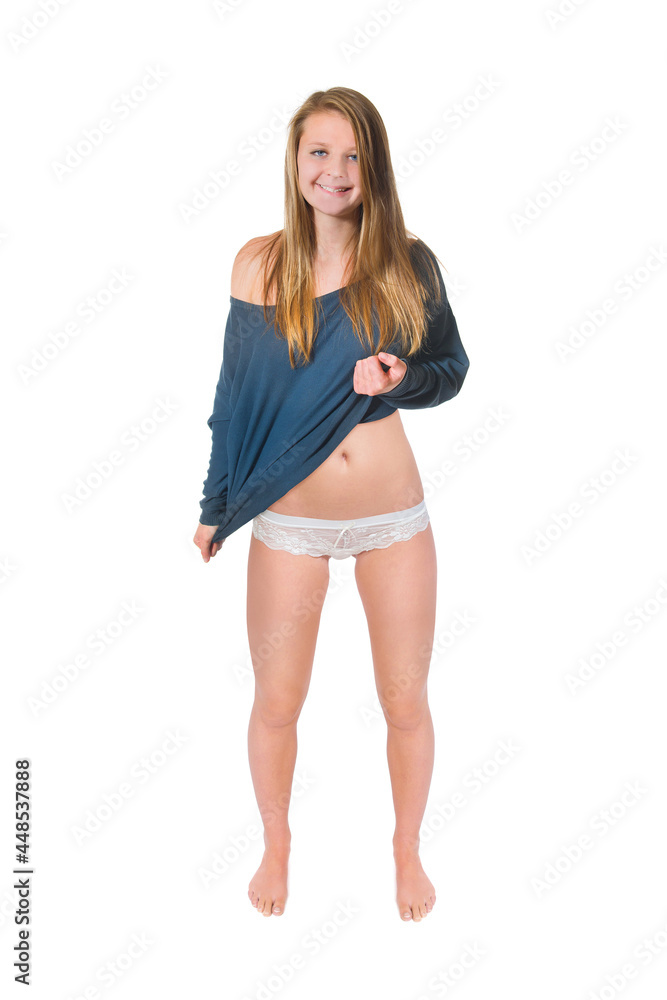 Full length portrait of a beautiful young woman undressing herself, isolated on white studio background Full length portrait of a beautiful young woman undressing herself, isolated on white studio background