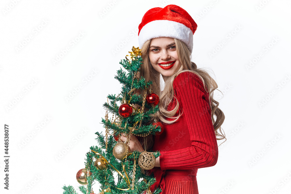 joyful woman with christmas tree in hands of toys holiday tradition joyful woman with christmas tree in hands of toys holiday tradition