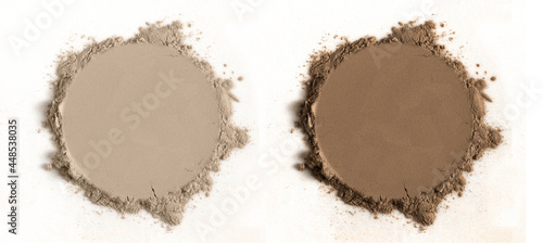 Cosmetic smooth power in a circular shape. The powder is in two skin tone shades, one light and the other dark