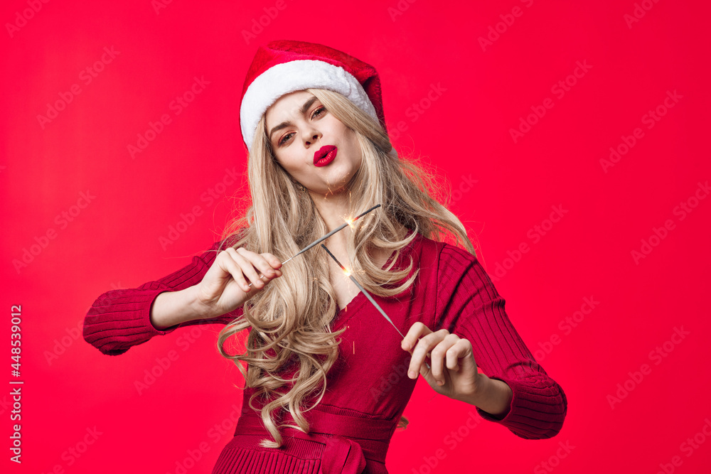 joyful woman in santa hat christmas holiday decoration sparklers joyful woman in santa hat christmas holiday decoration sparklers