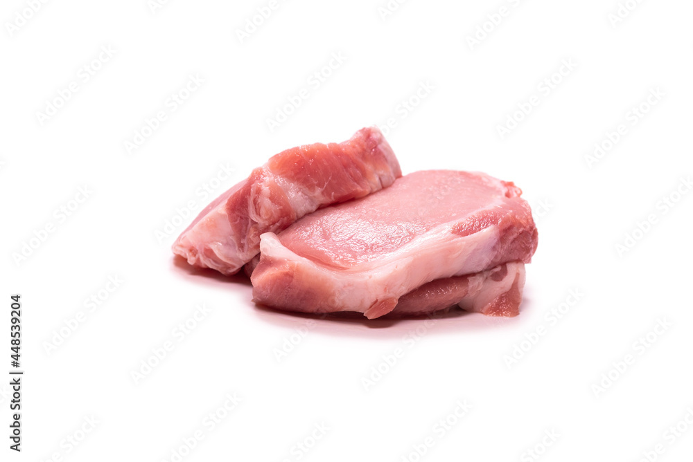 Raw pork pieces isolated on a white background.