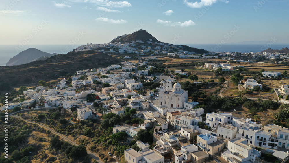 Aerial drone photo of picturesque uphill village of Tripiti with great views to bay of Adamantas near main town and capital of Milos island, Cyclades, Greece