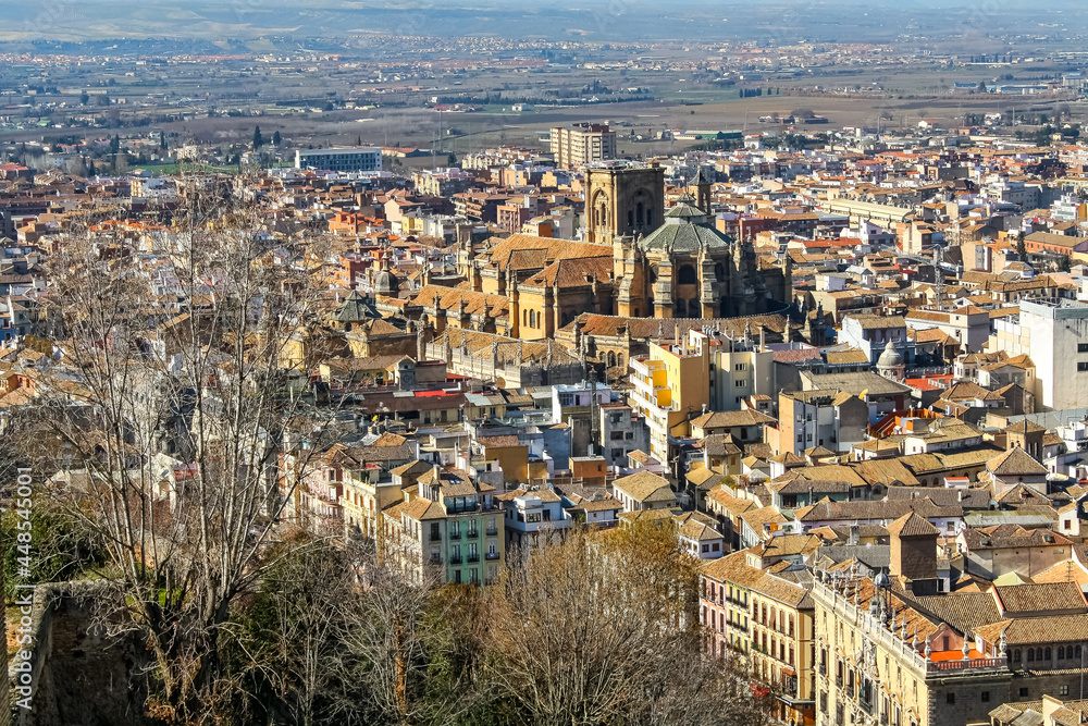 Aerial view of the city of Granada with its cathedral and historic buildings at the foot of the Alhambra.