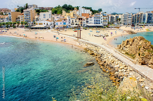 Canvas Print Tourists enjoy at the beach in Blanes in Costa Brava in a beautiful summer day,