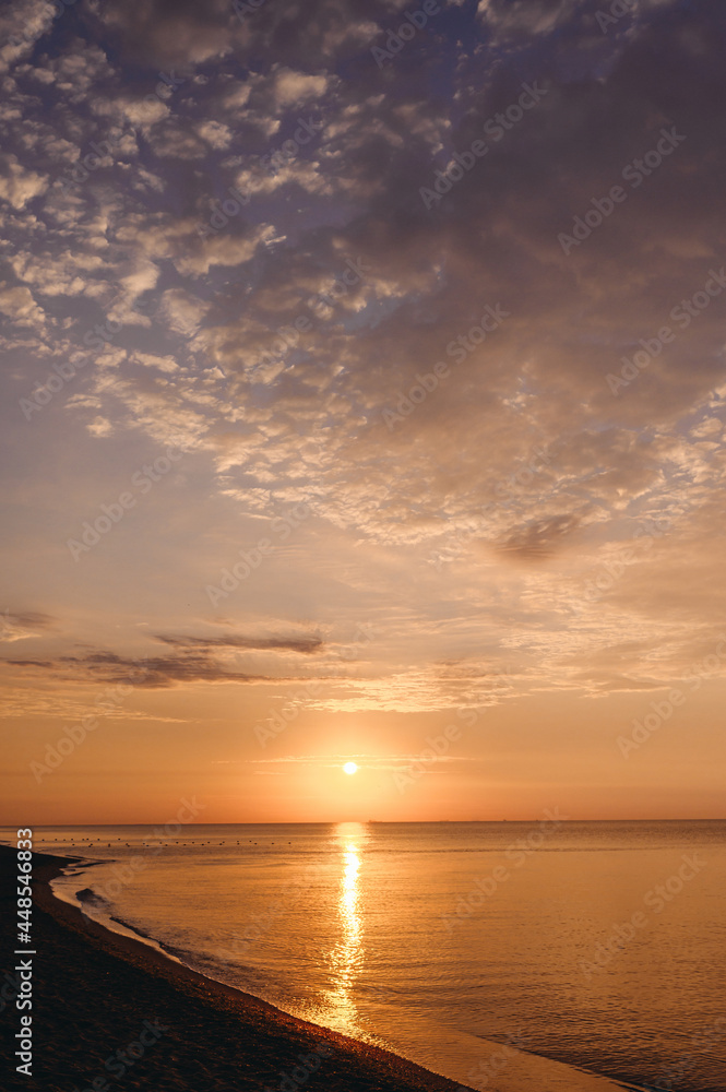 Beautiful exotic nature with sunrise over sea ocean nice coast in twilight. Summer beach with warm water and purple fluffy cloudy sky at sunset in morning Landscape tropical resort vacations concept.