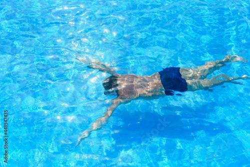 professional swimmer underwater after the jump © Serhii