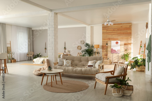 Fototapeta Naklejka Na Ścianę i Meble -  Spacious apartment interior with stylish wooden furniture. Idea for design