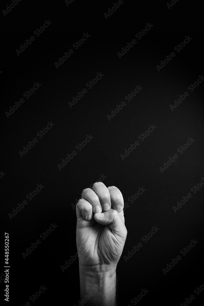 B&W image of hand demonstrating ASL sign language letter E with empty copy space B&W image of hand demonstrating ASL sign language letter E with empty copy space