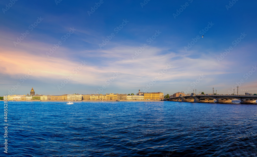 View of the river, panorama of the summer sunset St. Petersburg. Russia. Blagoveshchensky Bridge, Neva River, English Embankment, Sphinxes of the Academy of Arts, Vasilievsky Island.